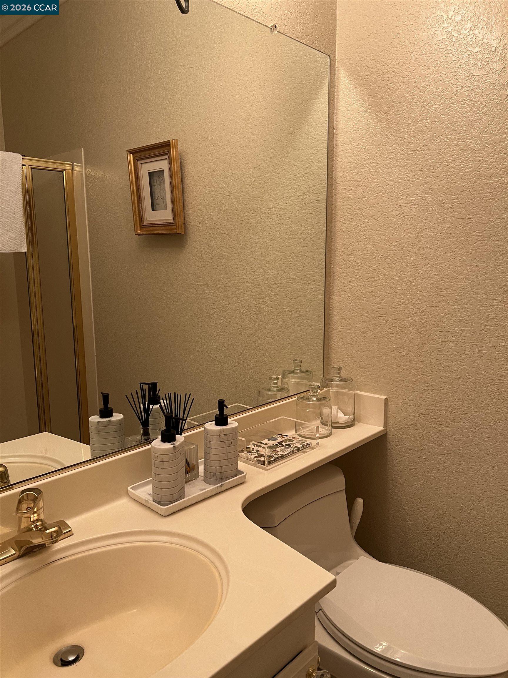 1312 Canyon Side Avenue San Ramon, CA 94582 - Photo 16 of 41 a bathroom with a sink toilet and mirror