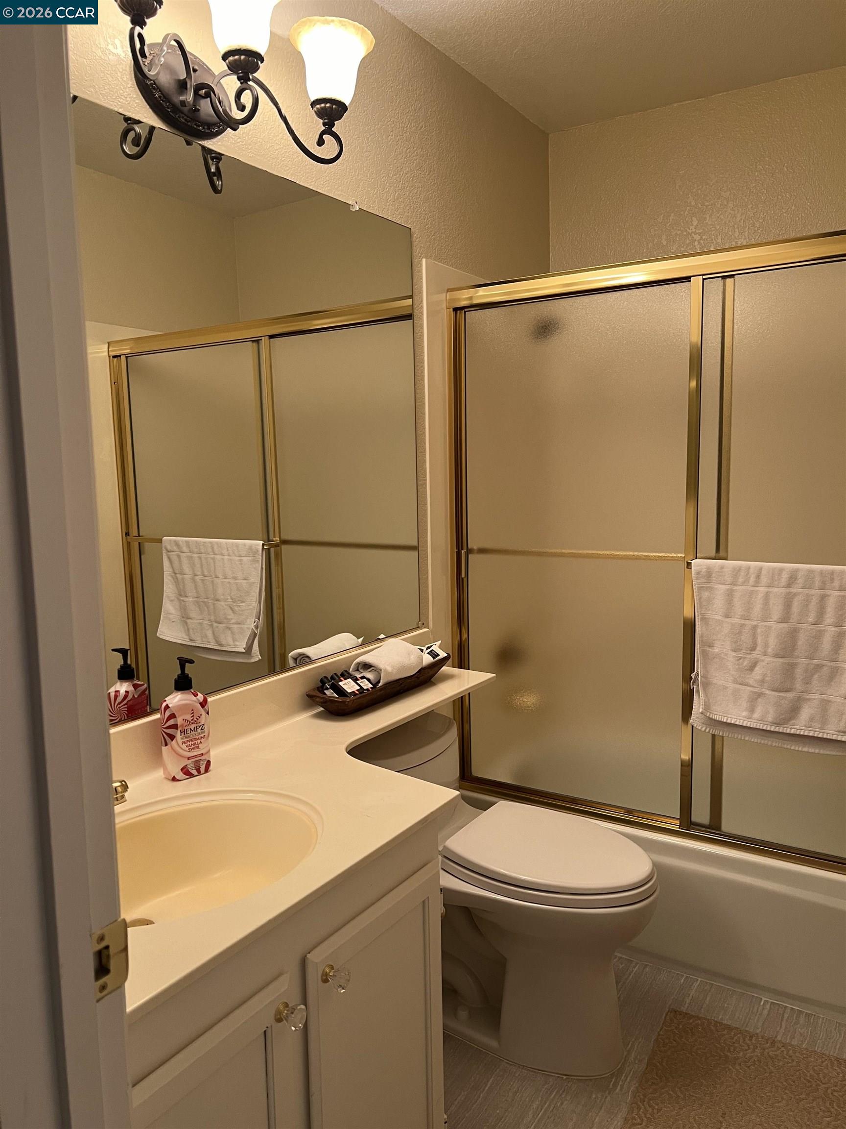 1312 Canyon Side Avenue San Ramon, CA 94582 - Photo 31 of 41 a bathroom with a sink a toilet and shower