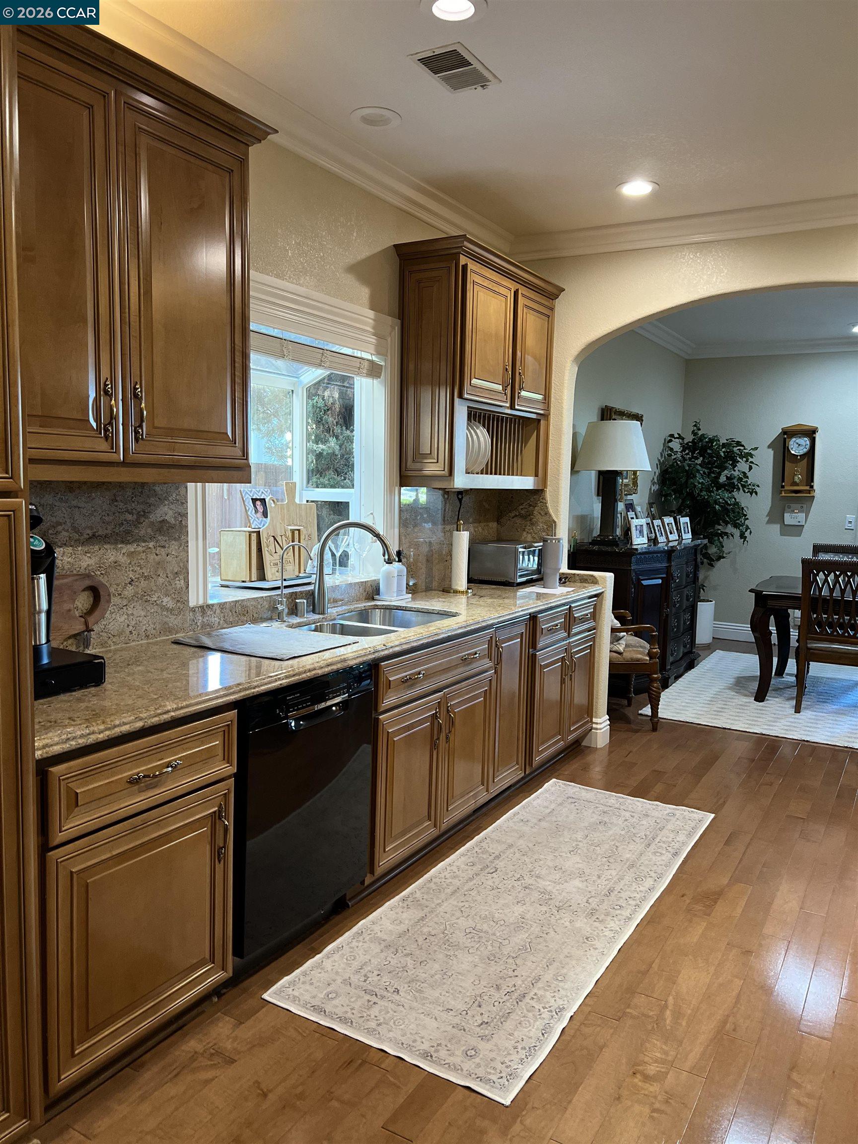 1312 Canyon Side Avenue San Ramon, CA 94582 - Photo 7 of 41 a kitchen with a sink cabinets and window