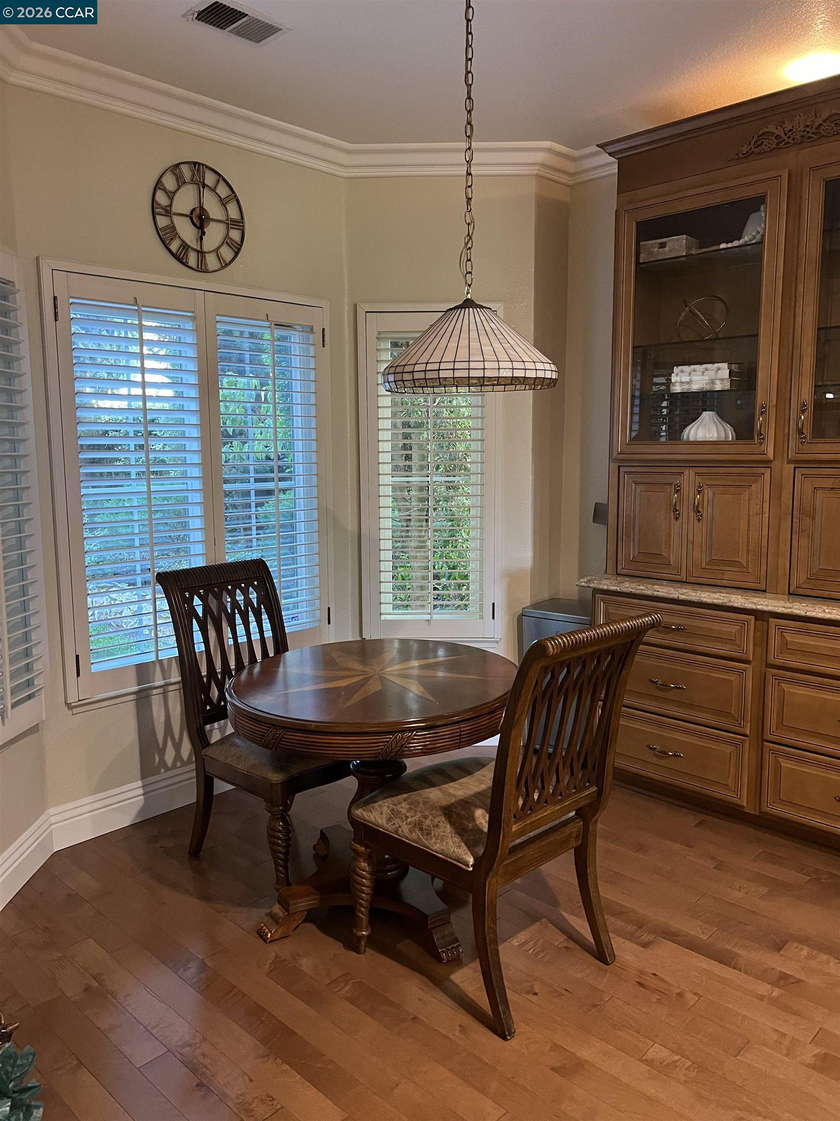 1312 Canyon Side Avenue San Ramon, CA 94582 - Photo 10 of 41 a dining room with furniture a chandelier and wooden floor