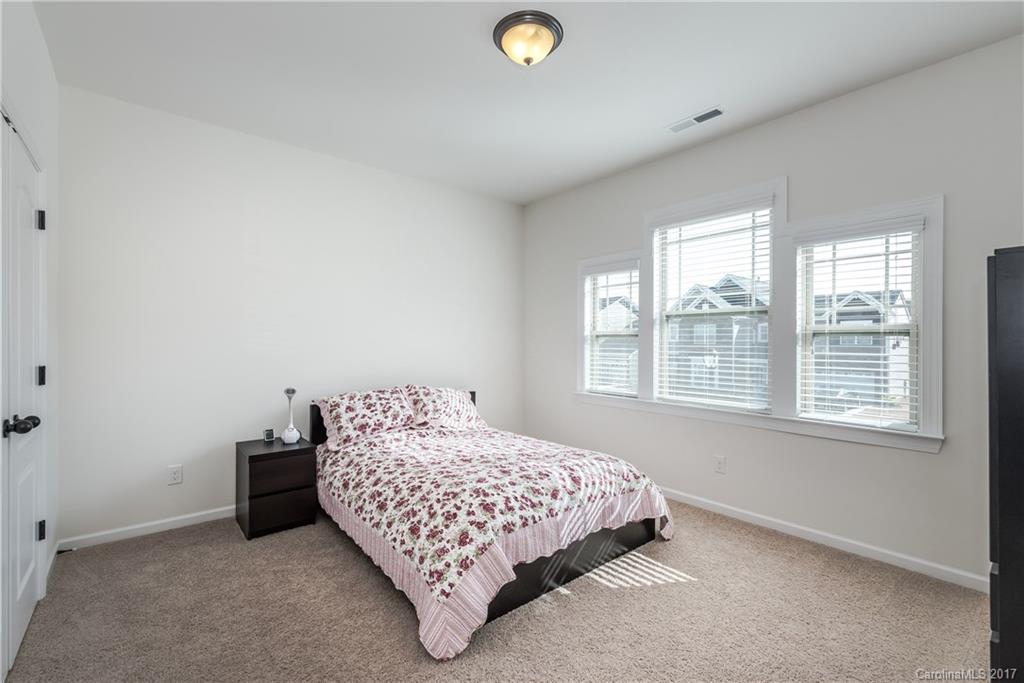 541 Brookhaven Drive, Unit 76 Fort Mill, SC 29708 - Photo 18 of 24 a bedroom with a bed and a window