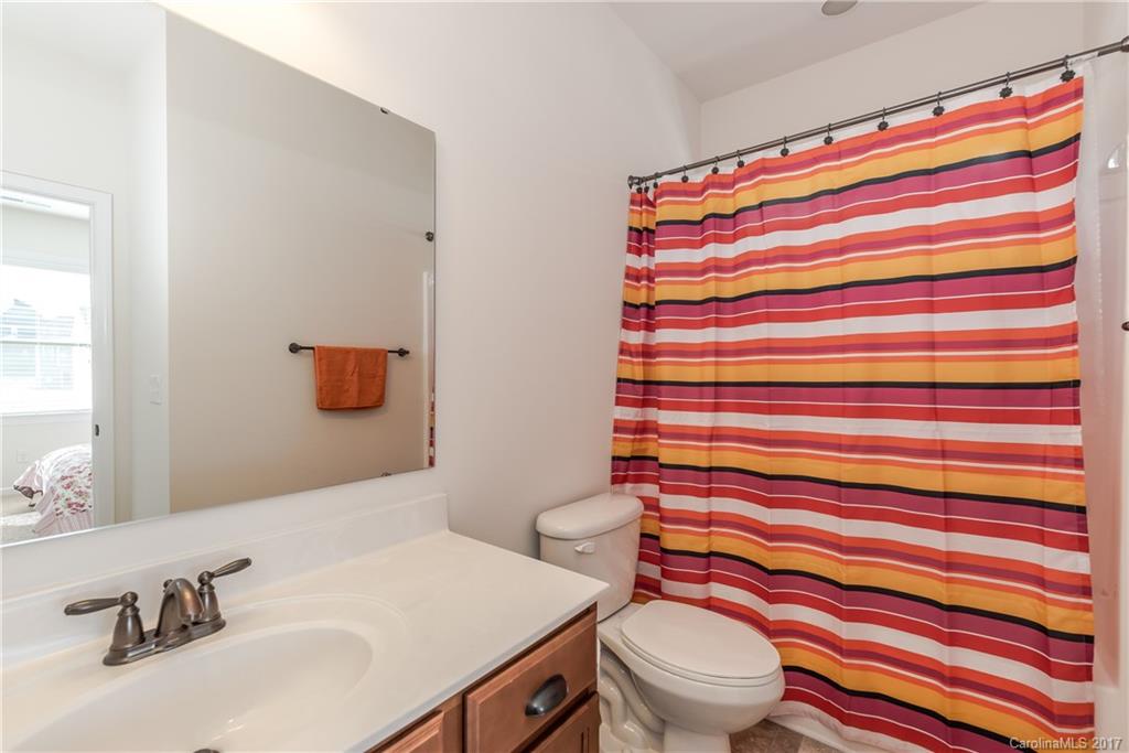 541 Brookhaven Drive, Unit 76 Fort Mill, SC 29708 - Photo 19 of 24 a bathroom with a sink toilet and shower