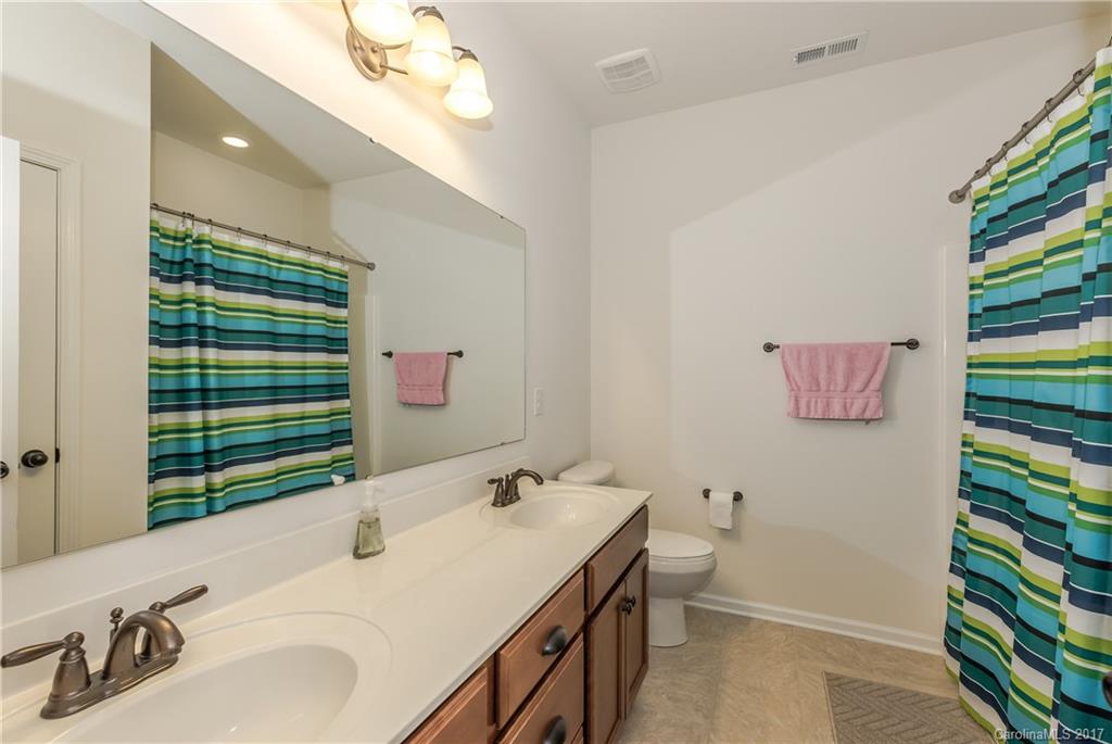 541 Brookhaven Drive, Unit 76 Fort Mill, SC 29708 - Photo 21 of 24 a bathroom with a sink and a mirror