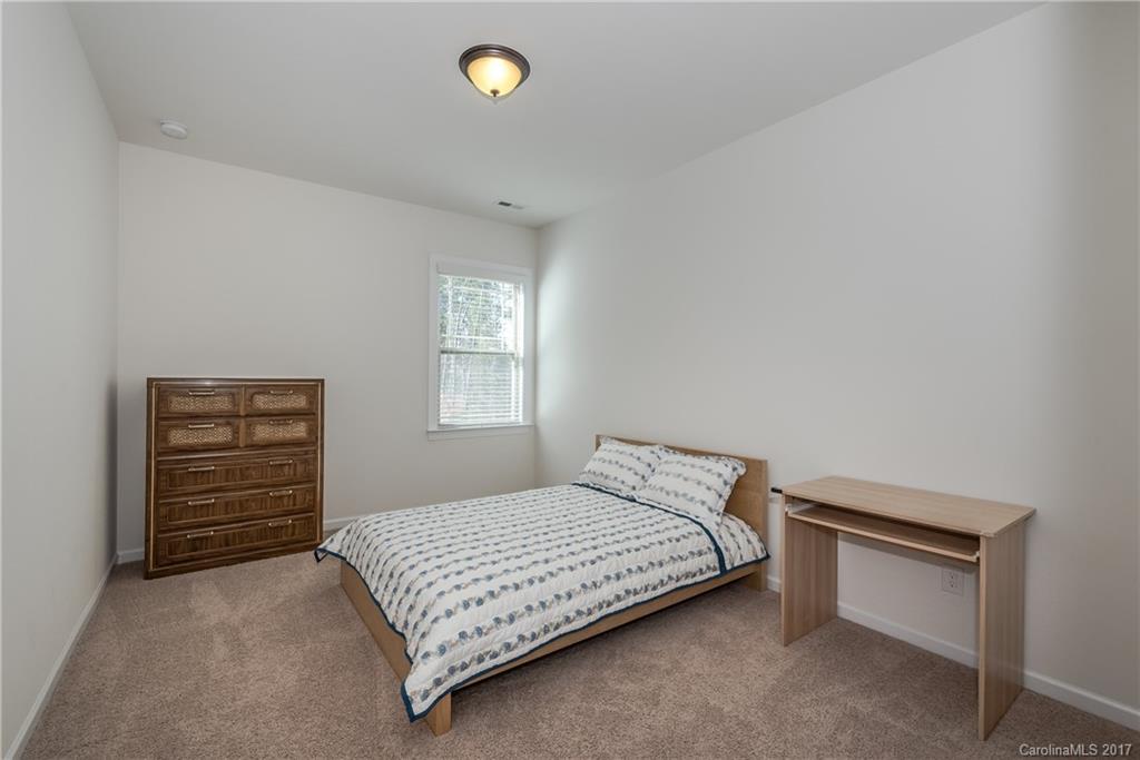 541 Brookhaven Drive, Unit 76 Fort Mill, SC 29708 - Photo 22 of 24 a bedroom with a bed and a window