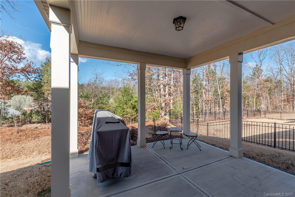 541 Brookhaven Drive, Unit 76 Fort Mill, SC 29708 - Photo 23 of 24 a living room with furniture and a floor to ceiling window