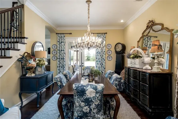 a kitchen with stainless steel appliances kitchen island granite countertop a lot of counter space and a dining table