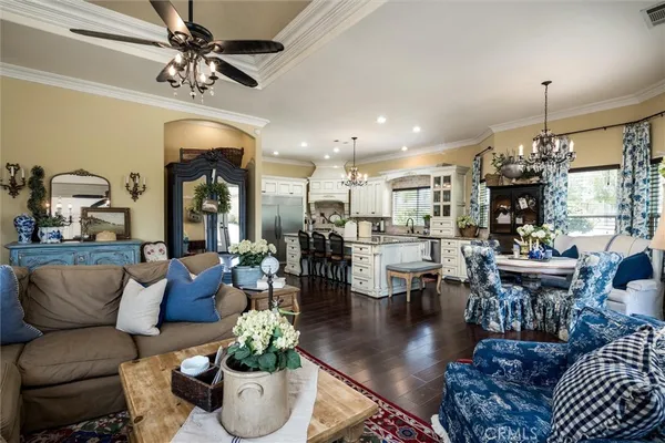 a living room with furniture fireplace and flat screen tv