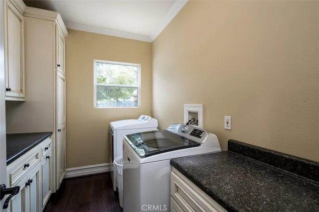 a living room with fireplace furniture and a chandelier