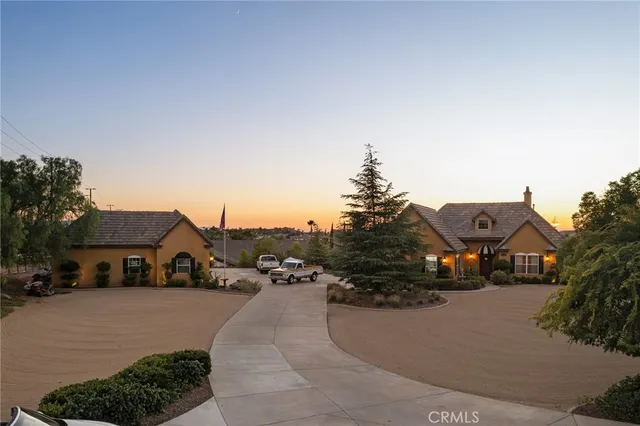 a view of city street with parked cars