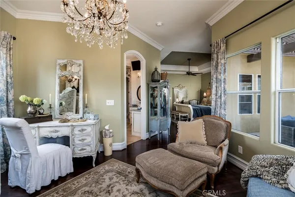 a living room with furniture and a clock