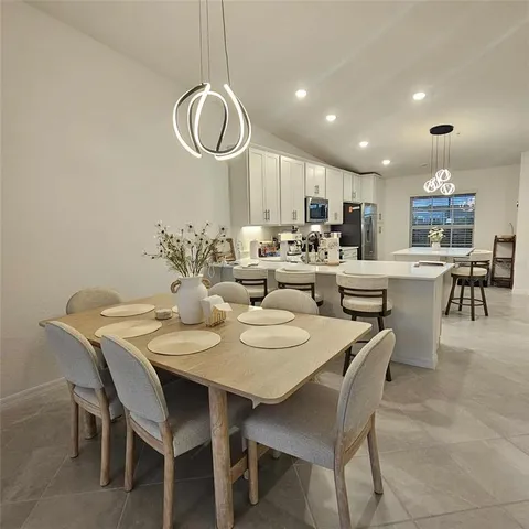 a view of a dining room with furniture
