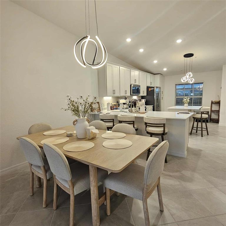 17470 Opal Sand Drive, Unit 201 Venice, FL 34293 - Photo 17 of 49 a view of a dining room with furniture