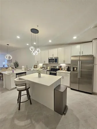 a kitchen with counter space cabinets and appliances