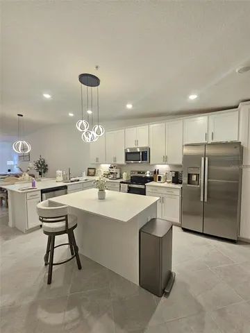 a kitchen with counter space cabinets and appliances