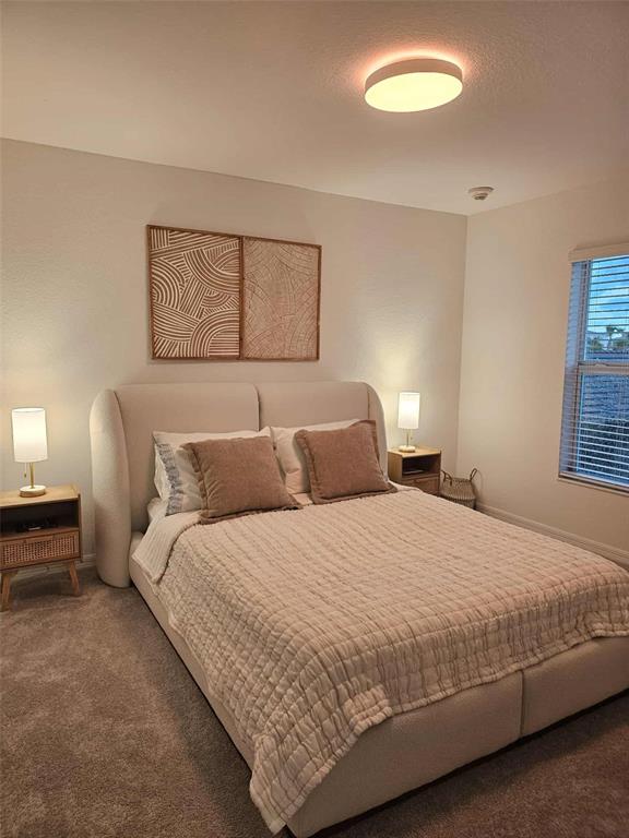 17470 Opal Sand Drive, Unit 201 Venice, FL 34293 - Photo 29 of 49 a bedroom with a bed and a window