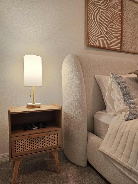 17470 Opal Sand Drive, Unit 201 Venice, FL 34293 - Photo 34 of 49 a bedroom with a bed and a window