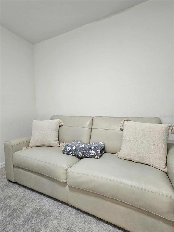 17470 Opal Sand Drive, Unit 201 Venice, FL 34293 - Photo 37 of 49 a living room with furniture