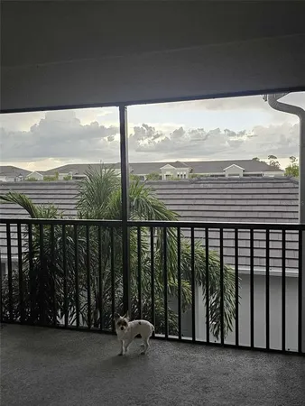 a view of a balcony with furniture