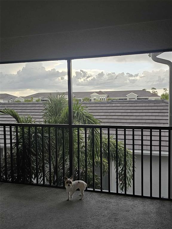 17470 Opal Sand Drive, Unit 201 Venice, FL 34293 - Photo 41 of 49 a view of a balcony with ocean view