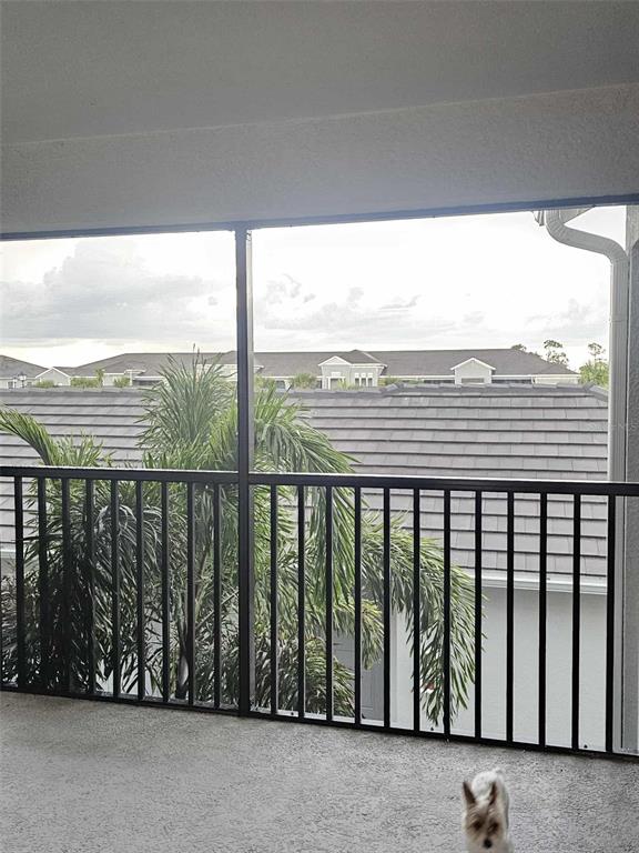 17470 Opal Sand Drive, Unit 201 Venice, FL 34293 - Photo 42 of 49 a view of a balcony with furniture