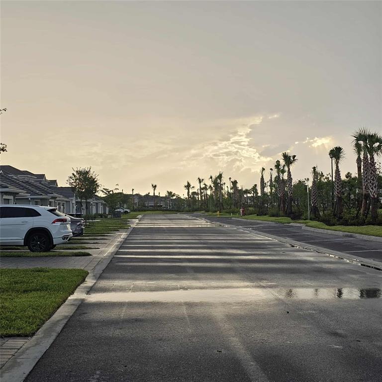 17470 Opal Sand Drive, Unit 201 Venice, FL 34293 - Photo 46 of 49 a view of a yard in front of a building