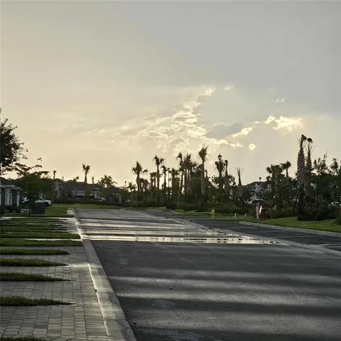a view of a pathway with house on both side