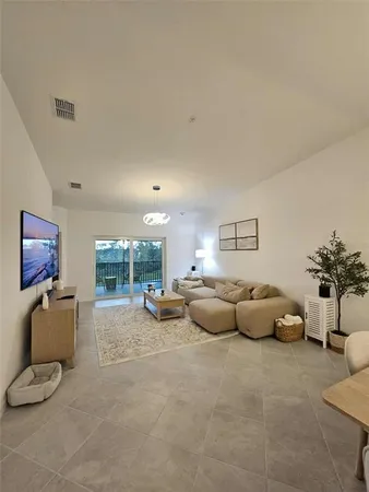 a living room with furniture and a couch