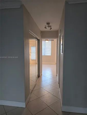 a view of an empty room and window