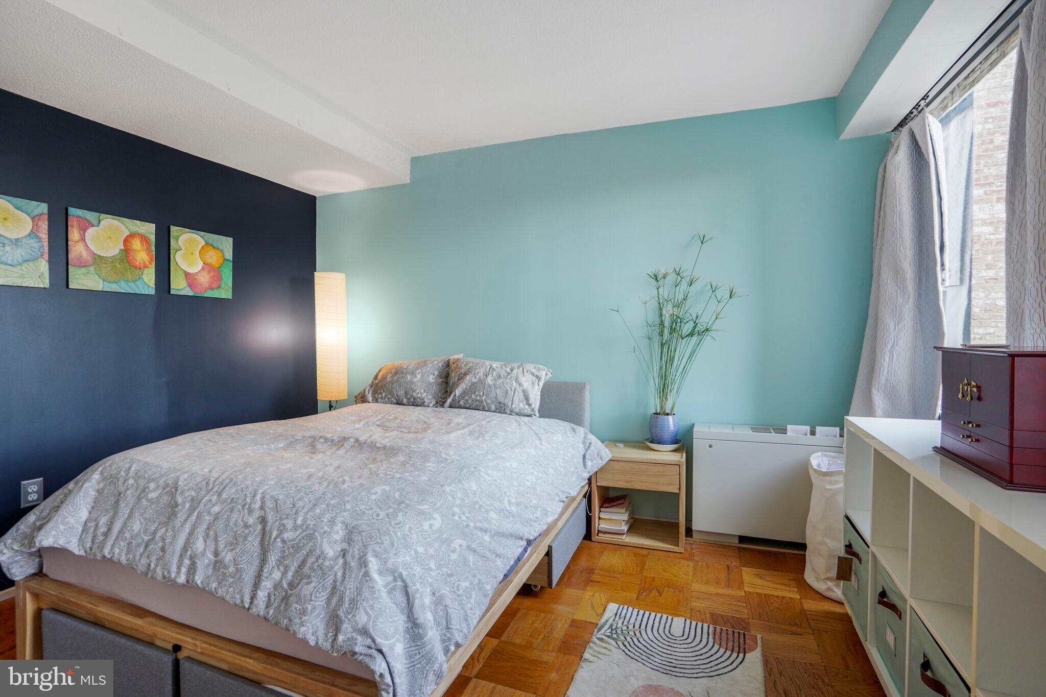 1301 Delaware Avenue Southwest, Unit N514 Washington, DC 20024 - Photo 10 of 44 a bedroom with a bed and a window