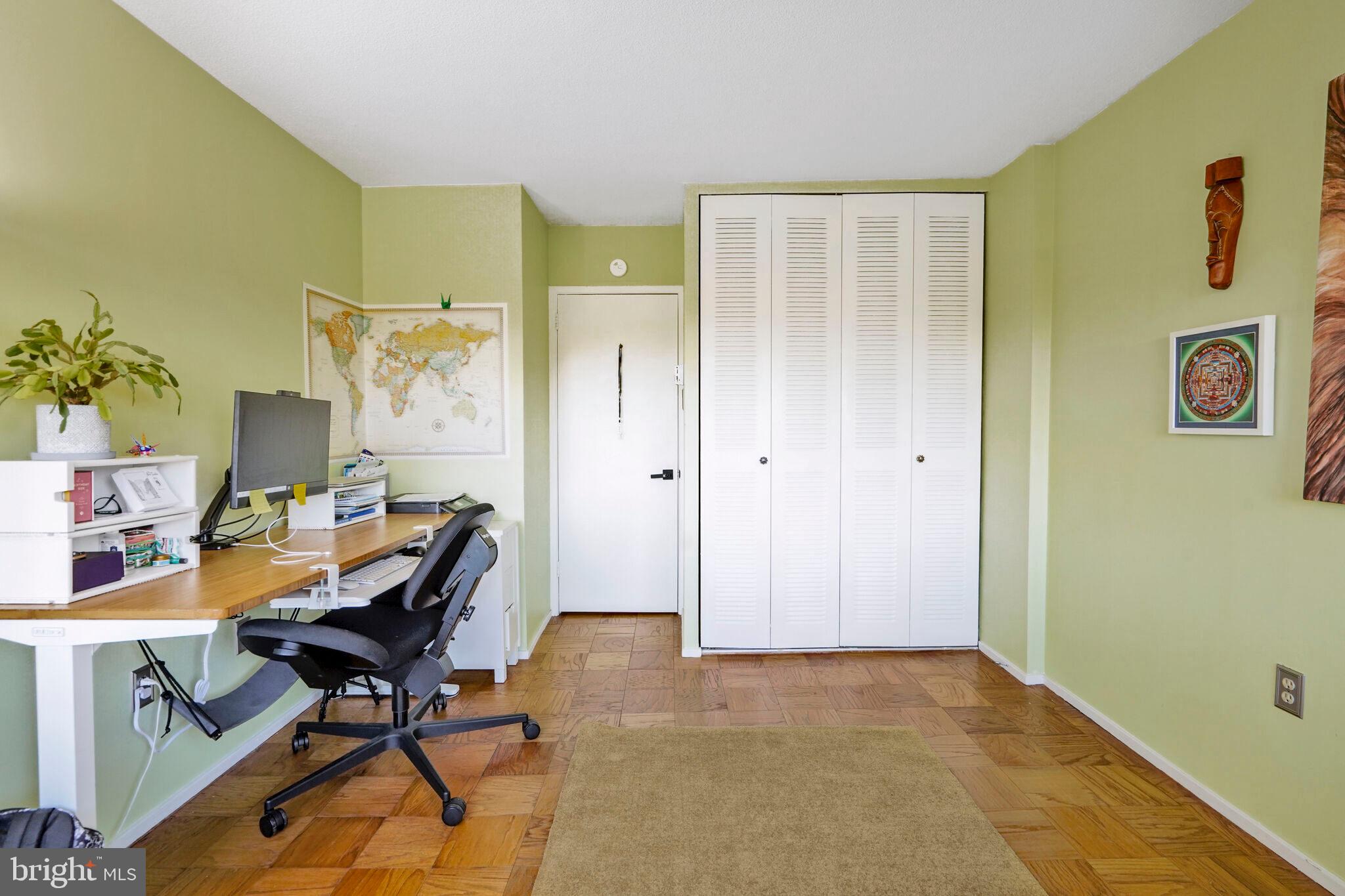 1301 Delaware Avenue Southwest, Unit N514 Washington, DC 20024 - Photo 13 of 44 a view of a workspace with furniture and a window