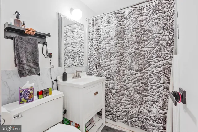 a reading room with furniture and a window