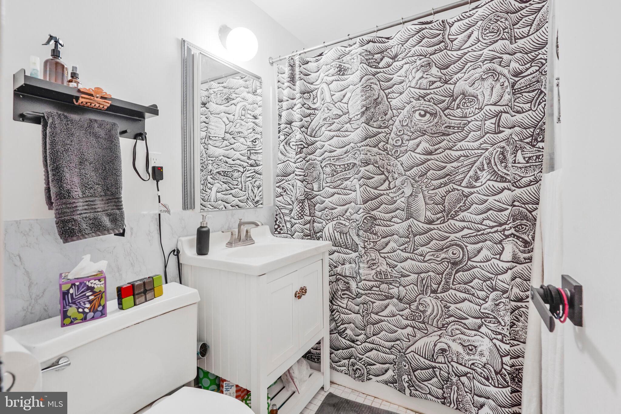1301 Delaware Avenue Southwest, Unit N514 Washington, DC 20024 - Photo 15 of 44 a white toilet sitting next to a bathroom sink