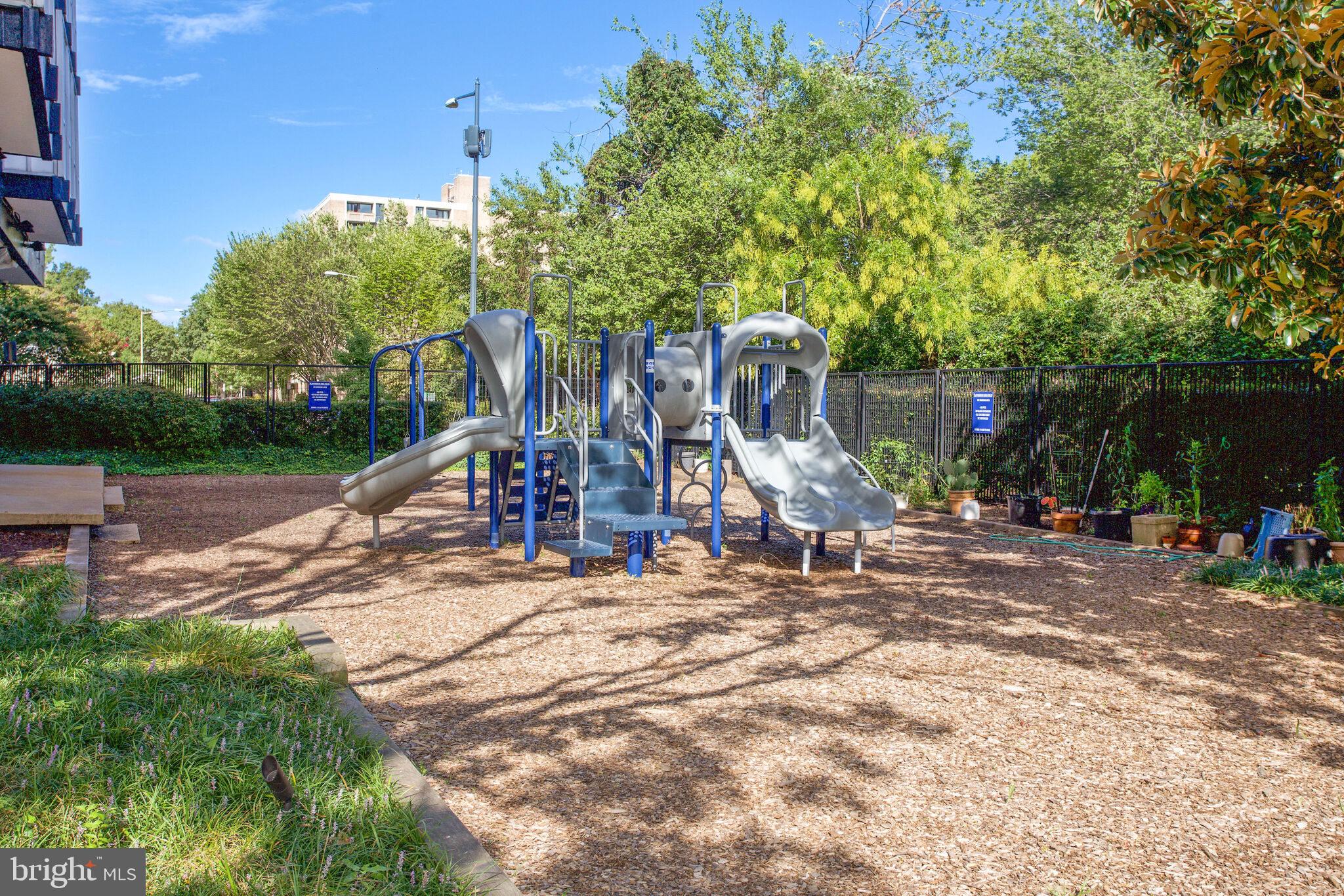 1301 Delaware Avenue Southwest, Unit N514 Washington, DC 20024 - Photo 17 of 44 a view of a park with swings and slides