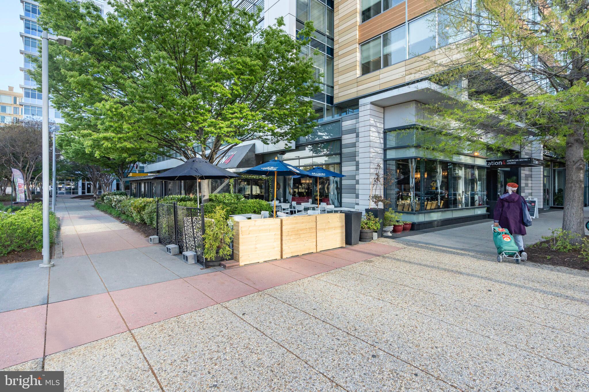 1301 Delaware Avenue Southwest, Unit N514 Washington, DC 20024 - Photo 30 of 44 a view of street with small shops