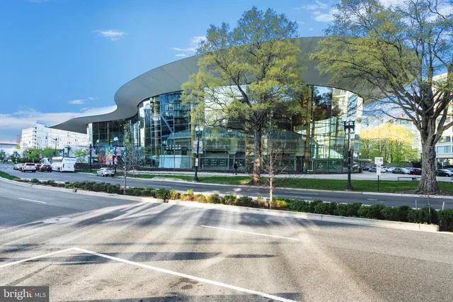 a patio with a table and chairs under an umbrella