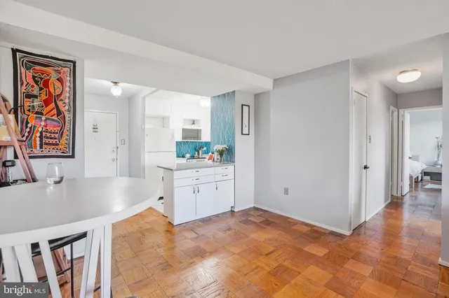 a view of kitchen with furniture and wooden floor