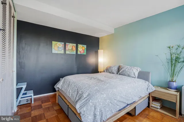 a room with kitchen island a sink a refrigerator and island