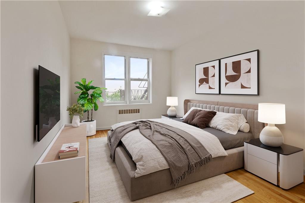 6801 Shore Road, Unit 5U Brooklyn, NY 11220 - Photo 11 of 21 a bedroom with a bed and a flat screen tv