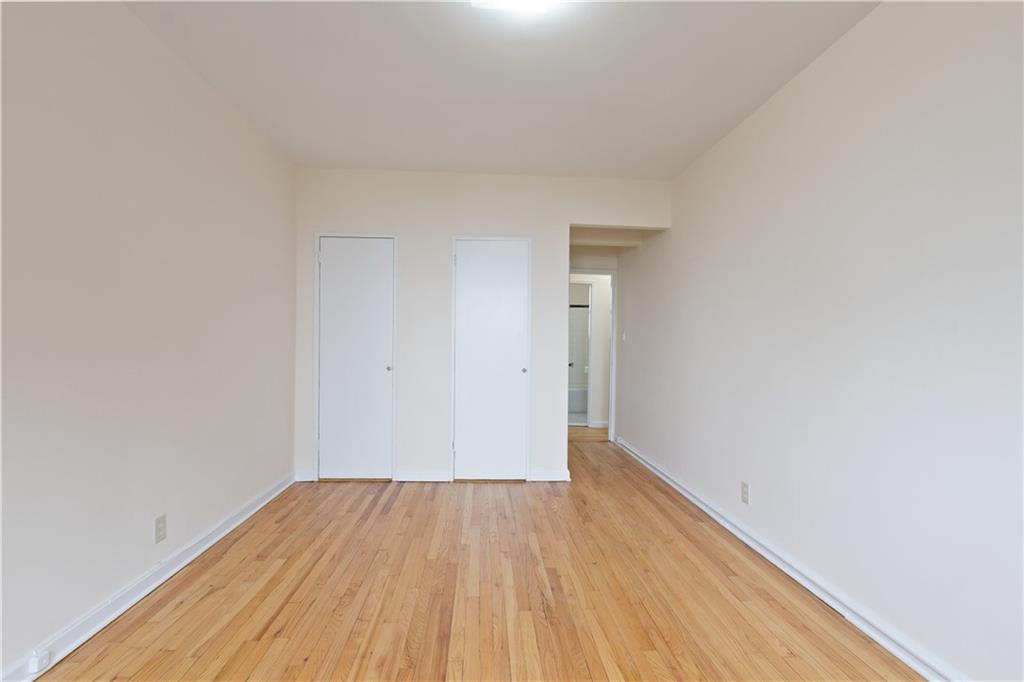 6801 Shore Road, Unit 5U Brooklyn, NY 11220 - Photo 14 of 21 a view of a room with wooden floor