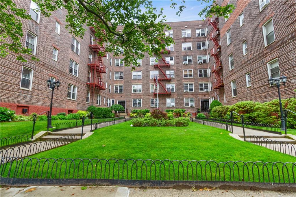 6801 Shore Road, Unit 5U Brooklyn, NY 11220 - Photo 20 of 21 a view of a building with a yard