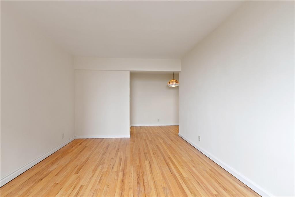 6801 Shore Road, Unit 5U Brooklyn, NY 11220 - Photo 2 of 21 a view of a room with wooden floor