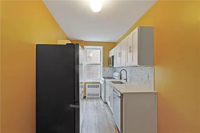 a bathroom with a sink vanity and a mirror