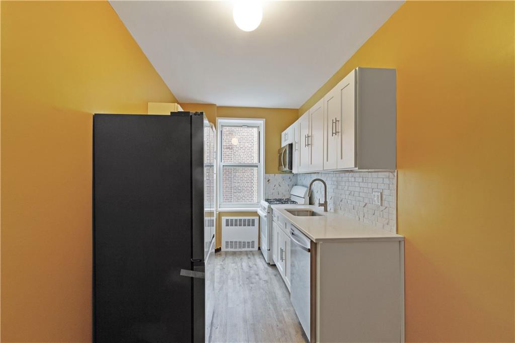 6801 Shore Road, Unit 5U Brooklyn, NY 11220 - Photo 6 of 21 a bathroom with a sink vanity and a mirror