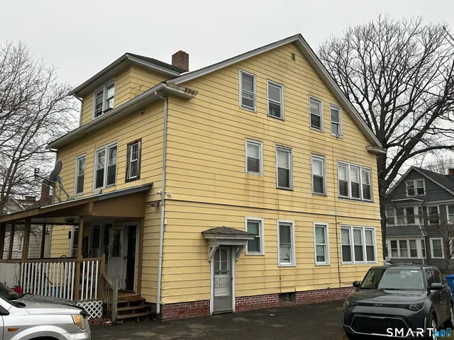 a front view of a house with a porch