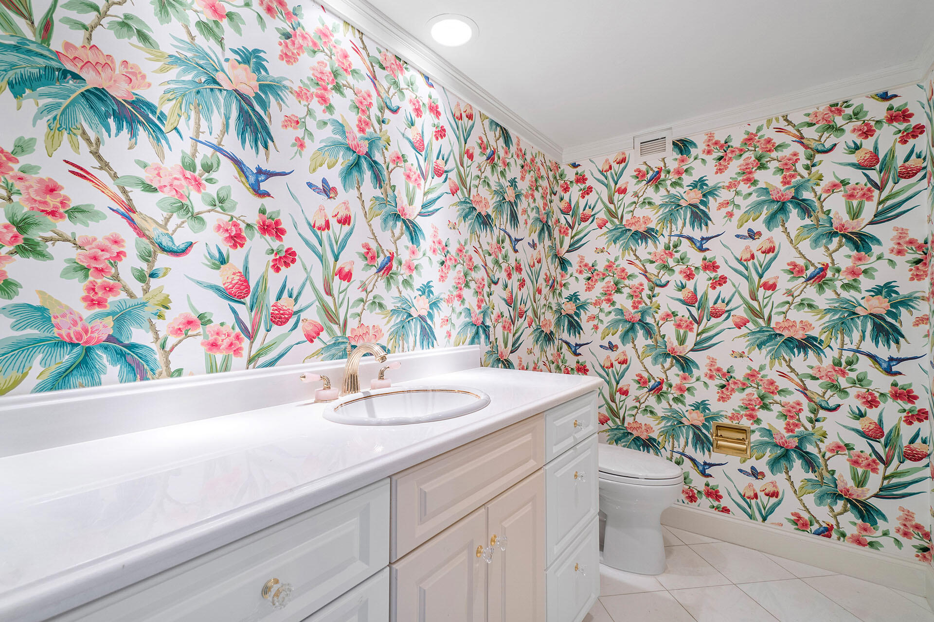 750 South Ocean Boulevard, Unit 5N Boca Raton, FL 33432 - Photo 17 of 30 a bathroom with a sink toilet and vanity