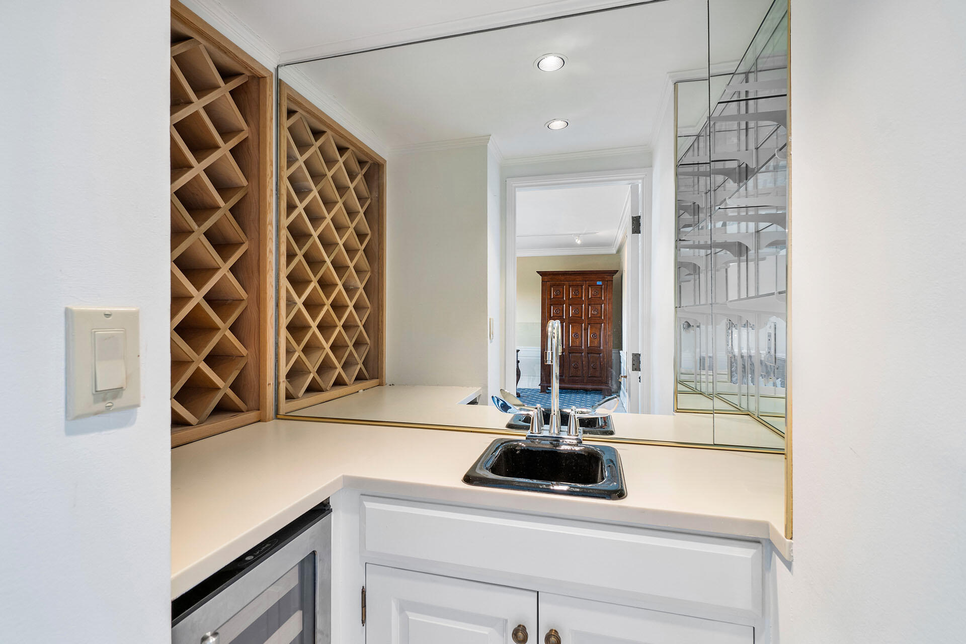 750 South Ocean Boulevard, Unit 5N Boca Raton, FL 33432 - Photo 18 of 30 a bathroom with a sink and a mirror