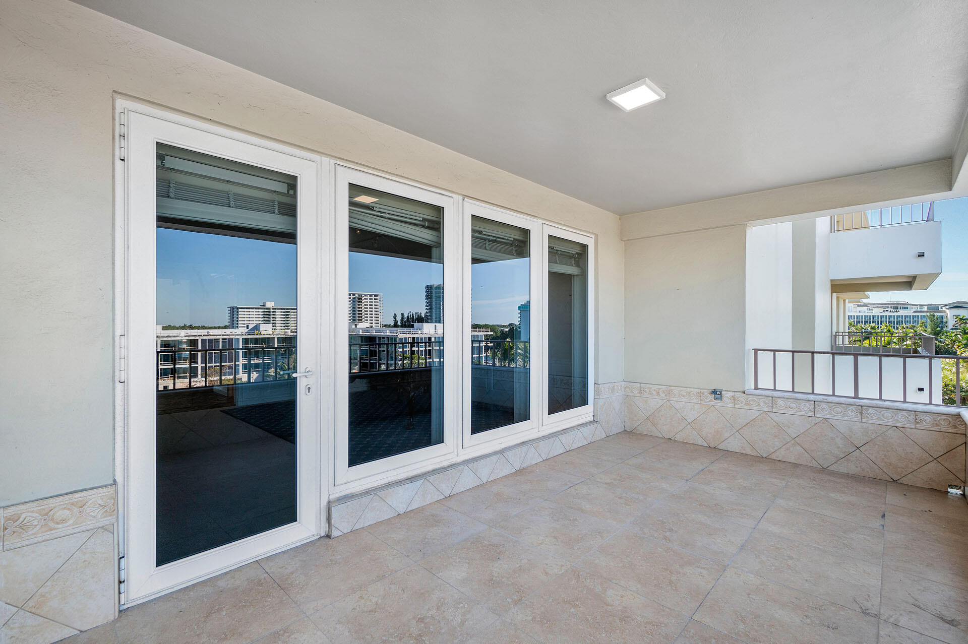 750 South Ocean Boulevard, Unit 5N Boca Raton, FL 33432 - Photo 22 of 30 an empty room with entrance and windows