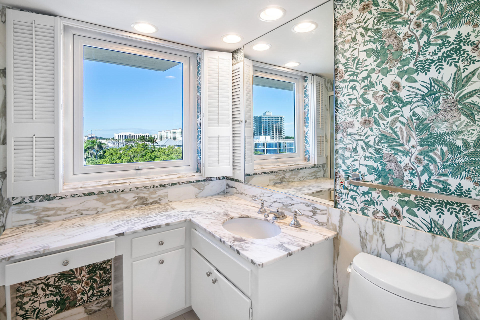 750 South Ocean Boulevard, Unit 5N Boca Raton, FL 33432 - Photo 24 of 30 a bathroom with a sink and a mirror