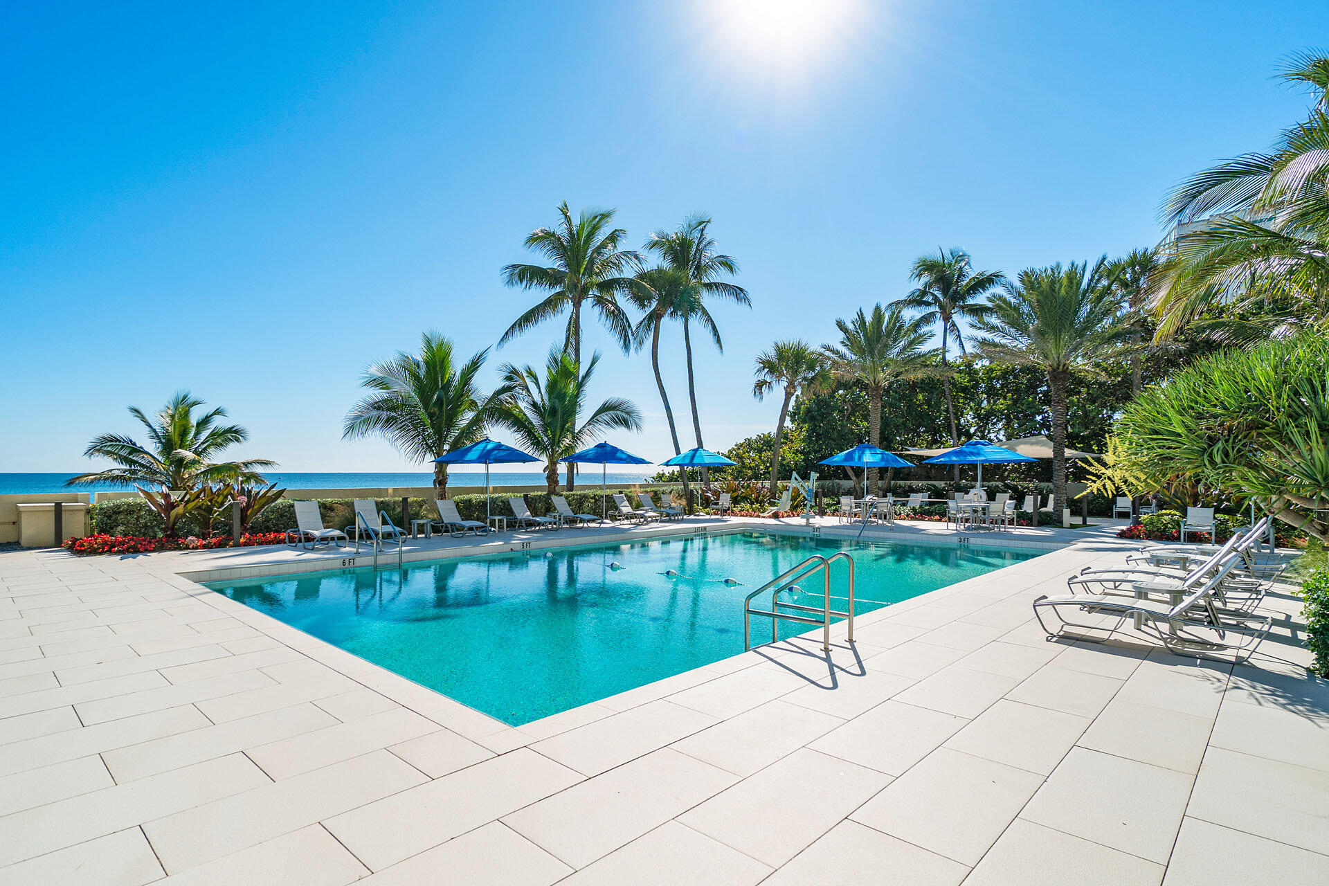 750 South Ocean Boulevard, Unit 5N Boca Raton, FL 33432 - Photo 4 of 30 a view of swimming pool with outdoor seating and house in the background
