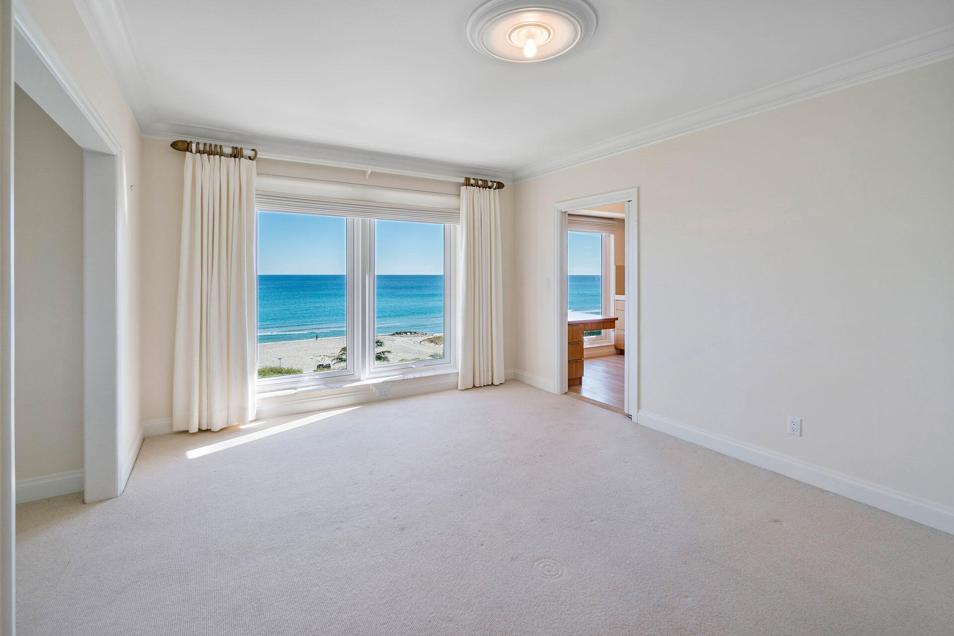 750 South Ocean Boulevard, Unit 5N Boca Raton, FL 33432 - Photo 10 of 30 a view of an empty room with a window